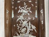 two framed pictures of birds and flowers on the wall