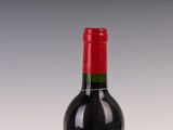 a bottle of wine that is sitting on a table