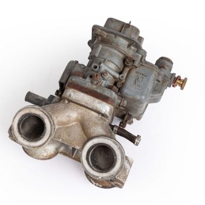 an old carbudge that is sitting on a white surface