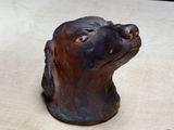 a statue of a dog that is sitting on a table
