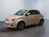 a pink smart car is parked in a white room