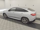 the mercedes gle is parked in the garage of a building