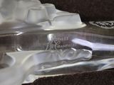 a glass bottle with a toothbrush inside of it