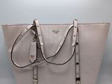 a close up of a purse with a strap on it