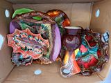 a cardboard box filled with a variety of decorative items