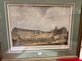tableau représentant la vue d'un palais, encadré et posé sur une table