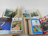 several books are open on a white surface with pictures on them