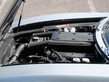 a close up of a car engine with its hood open