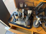 many different types of hair dryers and brushes on a table