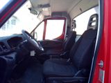 a red truck with black seats in the back of it