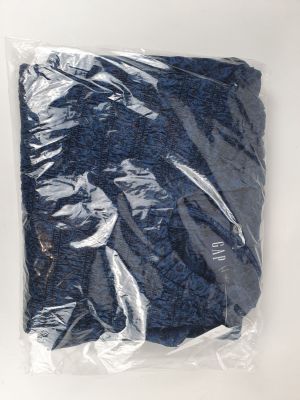 a bag of blue stuff sitting on a white surface