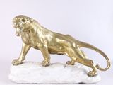 statue of a lion on a rock on a white background