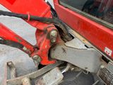 a close up of the front end of a red vehicle