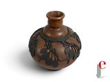 a small vase that has a design on it