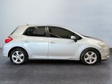 a picture of a small white car parked in a garage