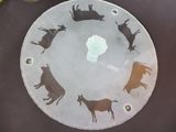 a picture of a glass plate with a picture of animals on it