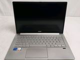 an open laptop computer sitting on top of a white surface