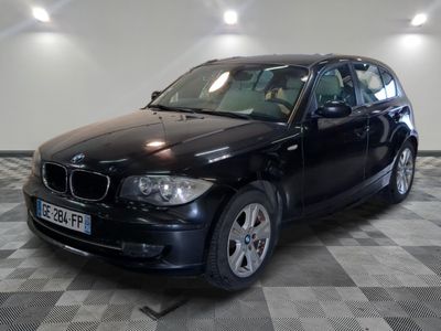 a picture of a black bmw car parked in a showroom