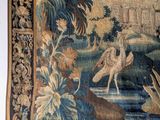 a tapestry hanging on the wall of a room
