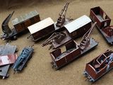 a lot of toy trains that are on a table