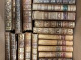 many old books in a box on the table