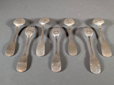 six silver spoons are arranged in a row on a gray surface