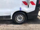 a white van with a red stripe on the side of it