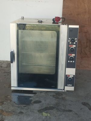 a small oven that is sitting in a room