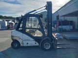 a picture of a forklift parked in a parking lot