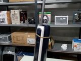 a vacuum that is sitting on a table in a room