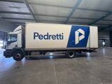 a delivery truck that is parked inside of a building
