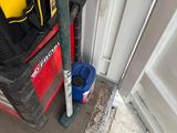 a bag of tools sitting on the floor next to the door
