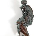 statue of a mermaid holding a fish on a white background
