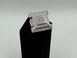 a close up of a diamond ring on a black stand