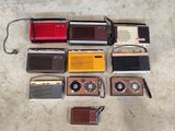 a lot of old radio ' s that are on the floor