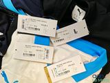 three luggage tags that are on top of a bag