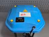 a blue plastic table with a clock on it