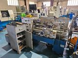 many machines that are sitting in a room together