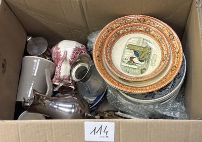 a cardboard box filled with assorted dishes and cups