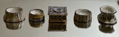 five different types of vases on the table