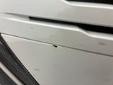 a close up of the front end of a washing machine