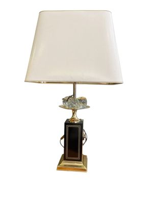 an image of a table lamp with a bird on top of it
