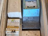 a box full of electronic equipment sitting on the ground