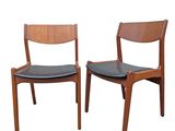 pair of mid century danish teak dining chairs with black leather seats