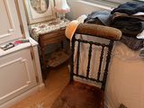 an image of a bedroom with a bed and a chair