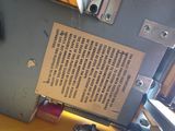 a sign on the back of a machine that is sitting on a table