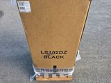 a box that is sitting on the ground in front of a truck