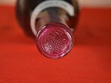 a bottle of wine that is sitting on a table