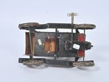 a small toy car that is sitting on a white surface