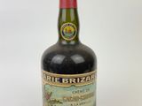 an image of a bottle of wine sitting on a white surface